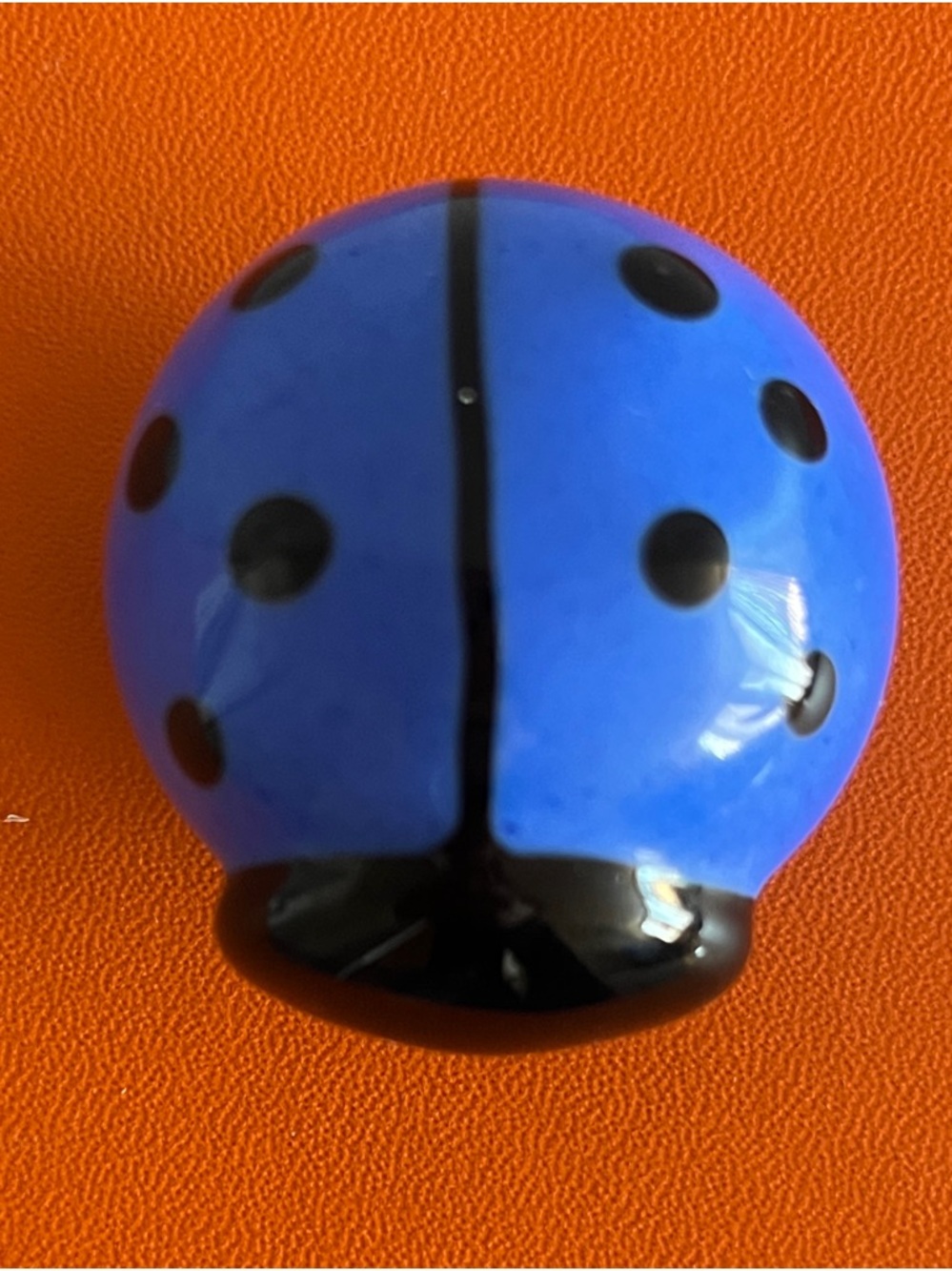 Collectable glass figurine shaped like a blue ladybug,